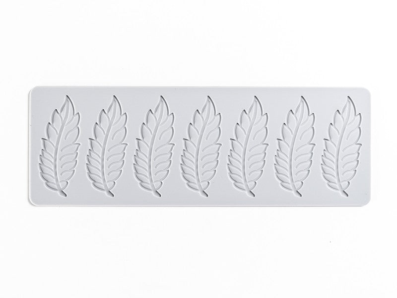 Molde en forma de pluma